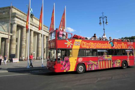 Berlin City Tour Bus in fronf of the Brandenburg Gate